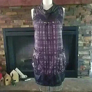 Plaid dress with cowl neck and pockets.
